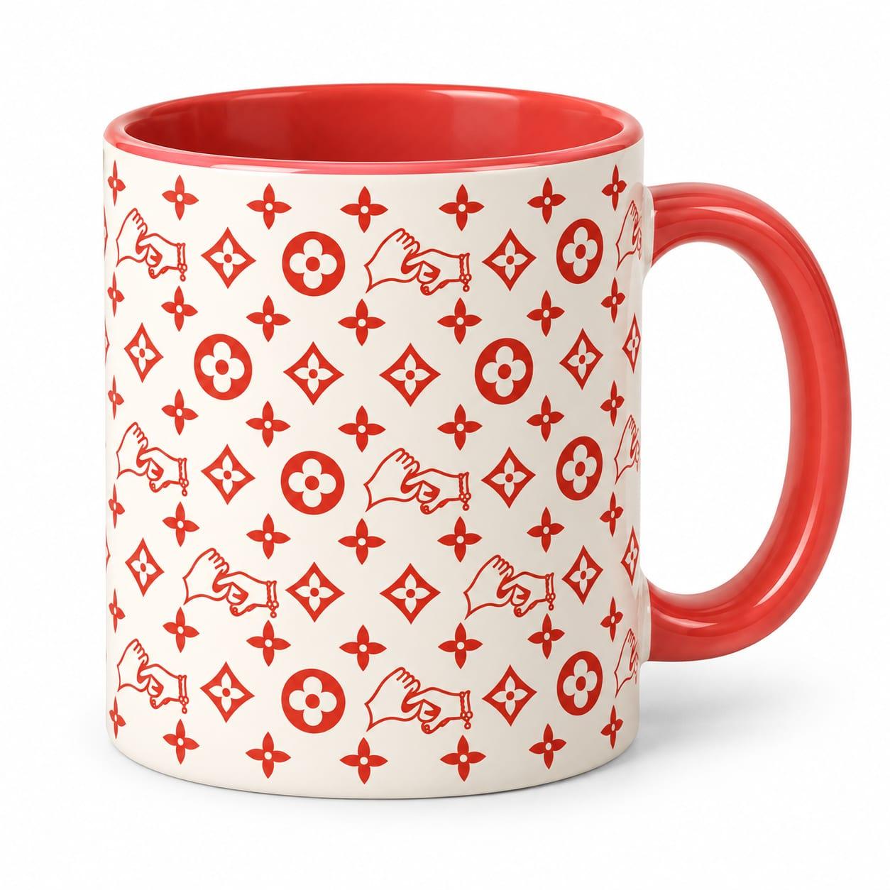 Cream mug with the red hands monogram, red inside and a red handle